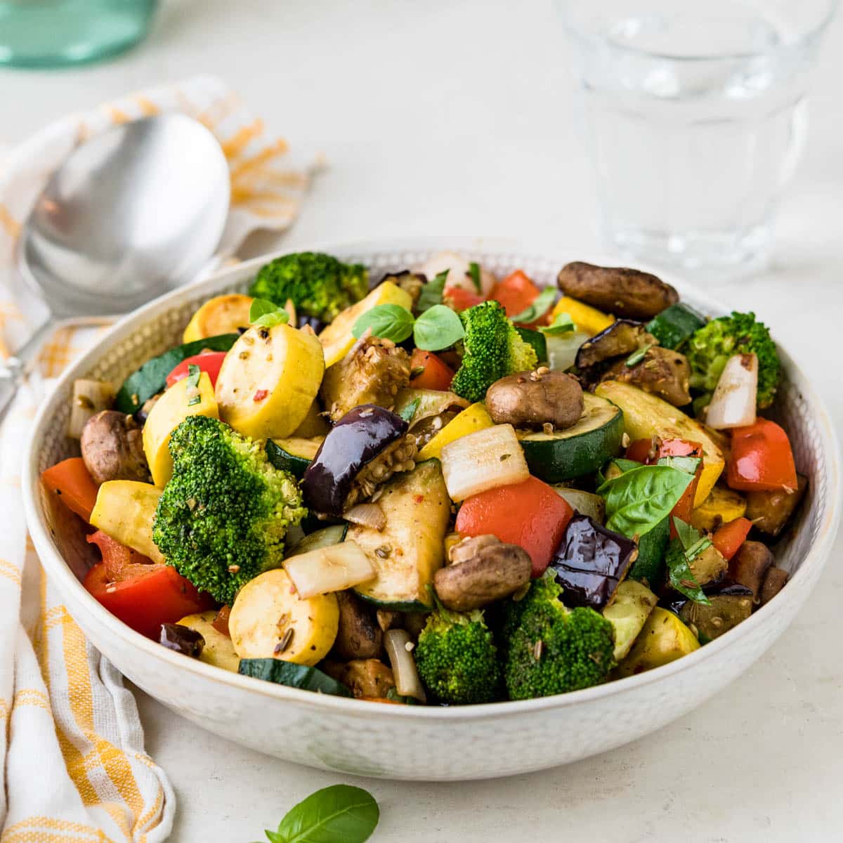 Colorful lunch bowl with mixed vegetables, grains, and protein sources